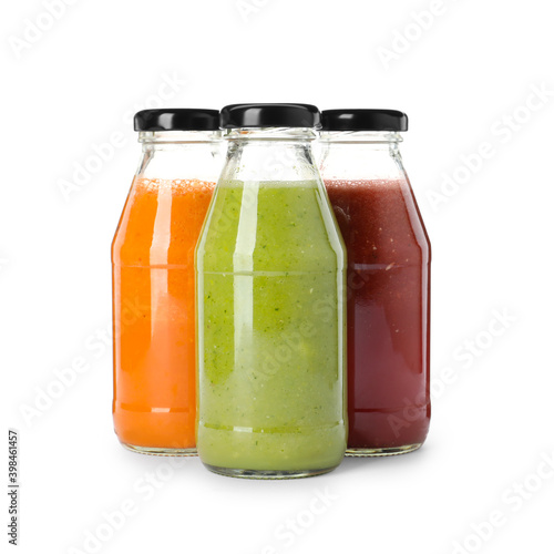 Bottles of fresh juices on white background