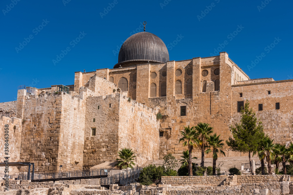 Siliver dome of Al-Aqsa Mosque, built on top of the Temple Mount, known as Haram esh-Sharif in Islam and wall of old city of Jerusalem, Israel.