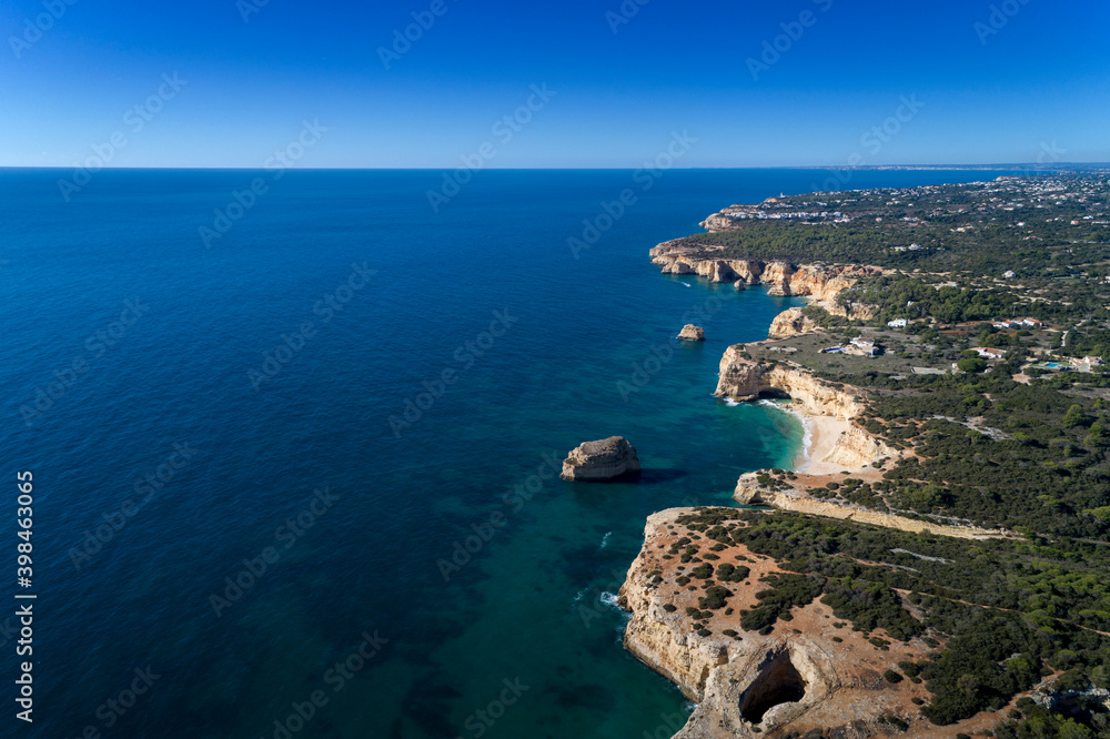 Aerial view of the beautiful coastline near Lagoa, in Algarve, Portugal.