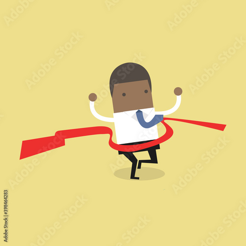 African businessman crossing finish line, he is won a competition.