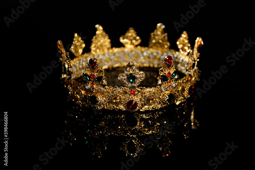 Beautiful golden crown on black background. Fantasy item