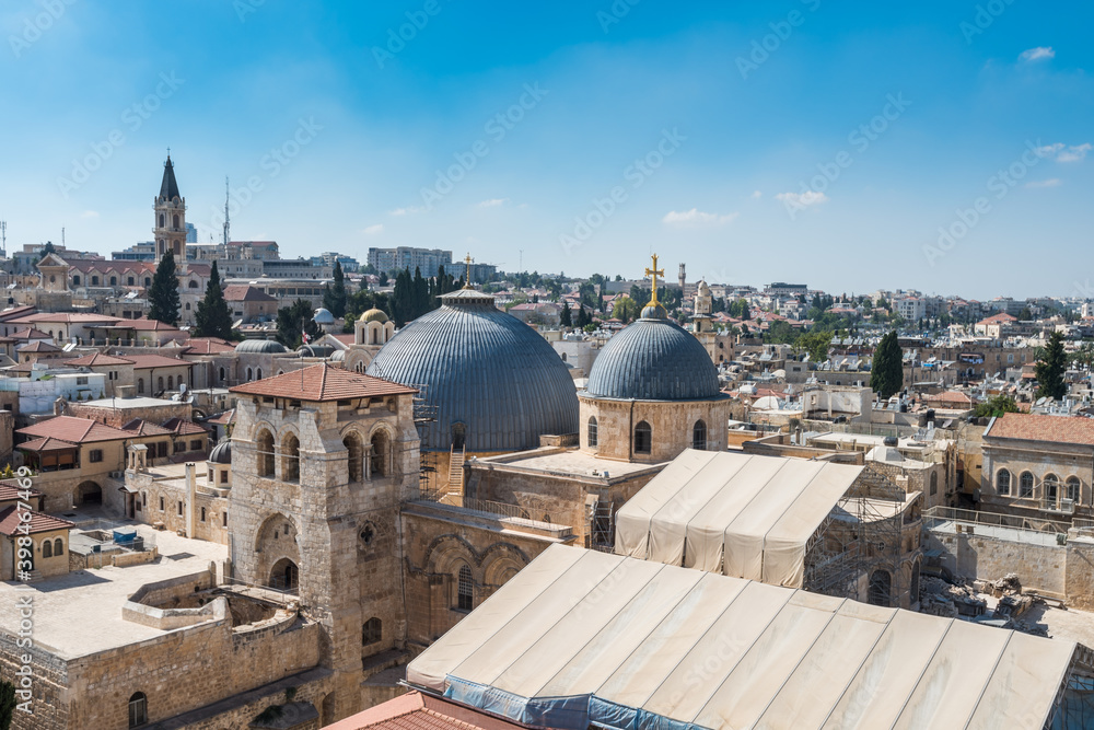 Aerial view of the old city with blue sky of Jerusalem. Christian quarter and dome of  the Church of the Holy Sepulchre. View from the Lutheran Church of the Redeemer.