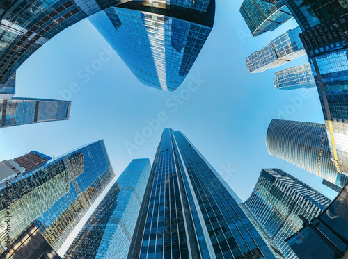 Futuristic view of the Moscow International Business Center Skyscrapers look-up panoramic view of modern city skyline with blue sky  office building exteriors with reflections in the glass walls 