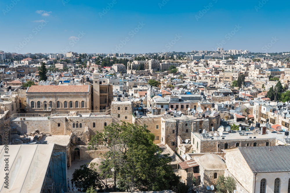 Aerial view of rooftops of buildings in the old city with blue sky of Jerusalem. View from the Lutheran Church of the Redeemer.