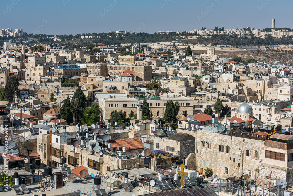 Aerial view of rooftops of buildings in the old city of Jerusalem with blue sky. View from the Lutheran Church of the Redeemer.