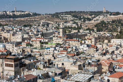 Aerial view of rooftops of buildings in the old city with Al-Ghawanimah Minaret of Jerusalem. View from the Lutheran Church of the Redeemer.