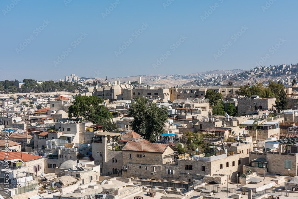 Aerial view of rooftops of buildings in the old city of Jerusalem with blue sky. View from the Lutheran Church of the Redeemer.