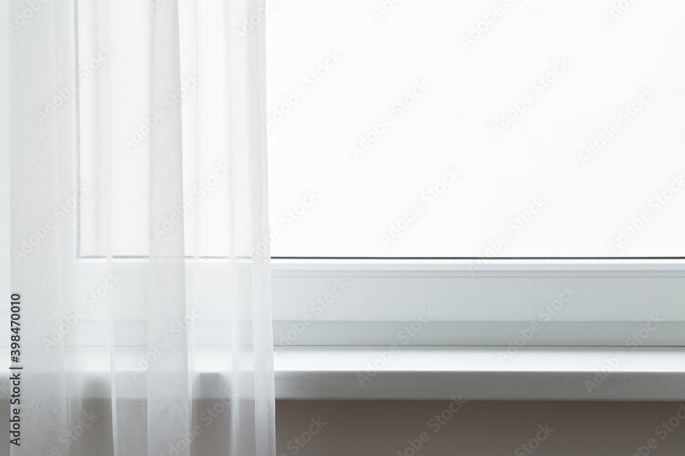 Opened day curtains at window in room. Empty windowsill. Free place for text on white glass. Front view. Closeup. Opened day curtains at window in room. Empty windowsill. Free place for text on white glass. Front view. Closeup.