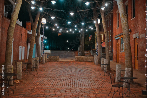 Outdoor Cafe With Porch Lights At Night On A Brick Pathway In Dover NH (New Hampshire)