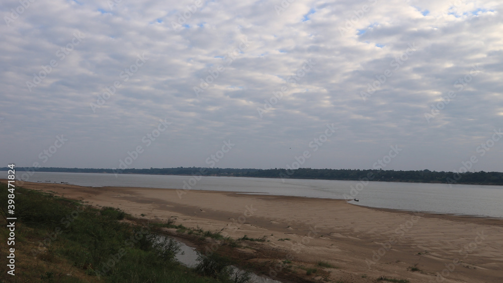 Long tail boats and sand dunes in the Mekong River Long tail boats and sand dunes in the Mekong River