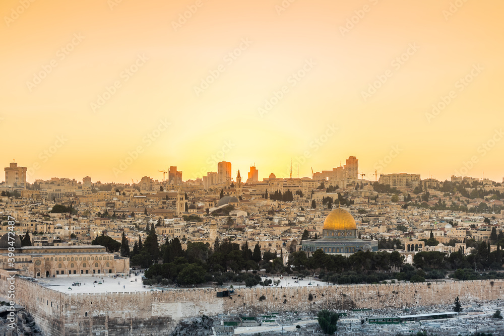  Old city of Jerusalem on the temple mount under golden sunset in the evening with golden dome of the rock, Al-aqsa mosque, sunset view from the Mount of Olives