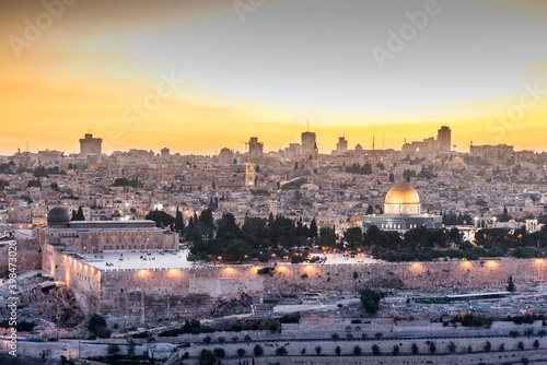 Old city of Jerusalem on the temple mount under beautiful sunset in the evening with golden dome of the rock, sunset view from the Mount of Olives