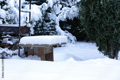 Wallpaper Mural Winter fairy tale. Snow-covered courtyard, barbecue with a wooden table, trees covered with snow Torontodigital.ca