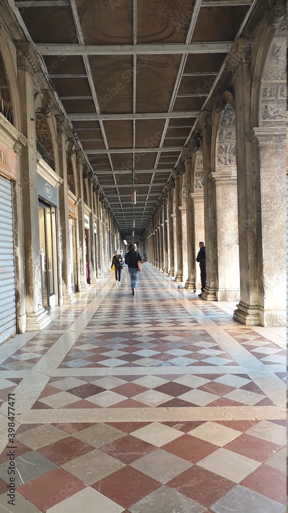 Venice, Italy, Tourists under the gallery of the Doge Palace