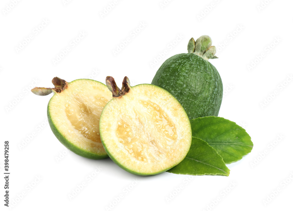 Cut and whole feijoas with leaves on white background Cut and whole feijoas with leaves on white background