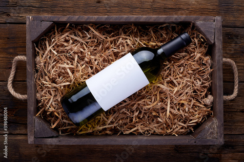 White wine bottles packed in open wooden box