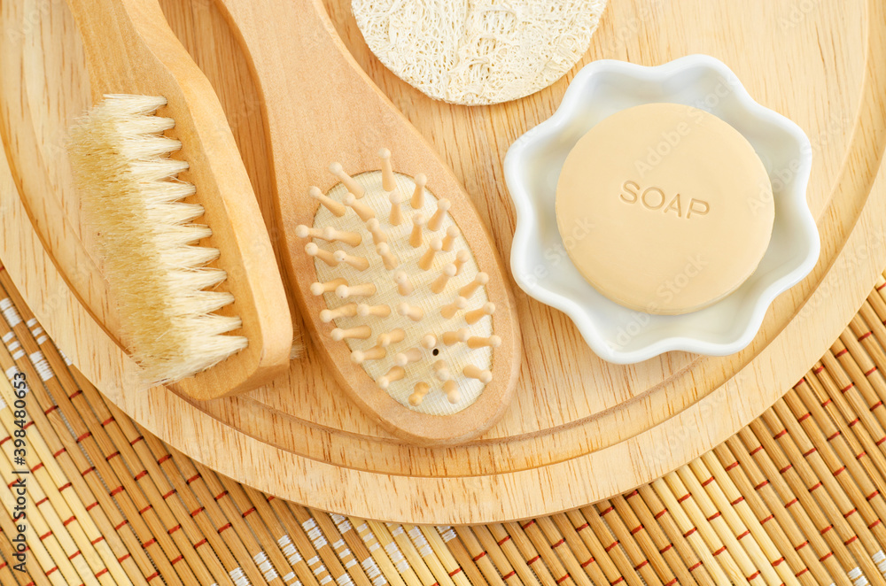 Bar of soap, wooden hair brush and body massage brush. Eco friendly toiletries. Natural beauty treatment, skin-care or zero waste concept. Top view, copy space. Bar of soap, wooden hair brush and body massage brush. Eco friendly toiletries. Natural beauty treatment, skin-care or zero waste concept. Top view, copy space.
