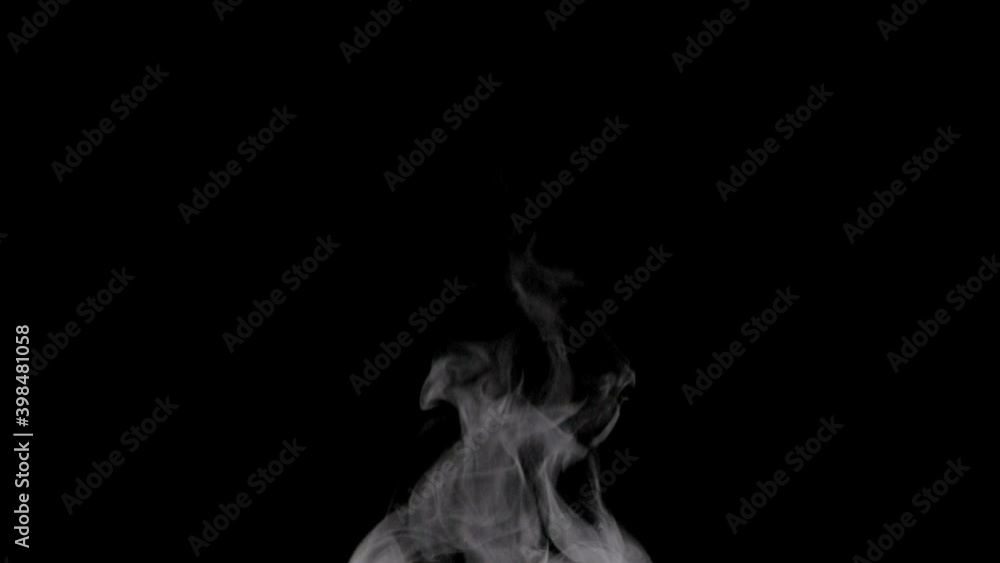 White steam isolated on black. Trickle of Steam Slowly Rising from the Cup. White steam rises graceful twists on a black background. Footage is perfect for the layer with different blending modes. White steam isolated on black. Trickle of Steam Slowly Rising from the Cup. White steam rises graceful twists on a black background. Footage is perfect for the layer with different blending modes.