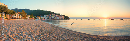deserted beach Moscenicka Draga, seascape in the morning mood with rising sun photo