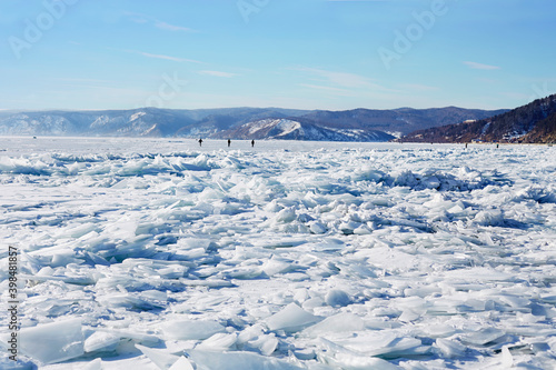 Beautiful landscape of frozen Lake Baikal on a winter day. Fields of ice hummocks in the village of Listvyanka