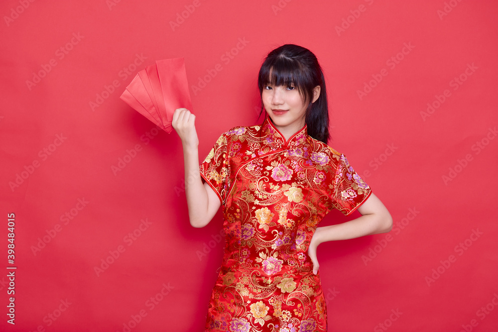 woman wearing red cheongsam Holding Envelope woman wearing red cheongsam Holding Envelope