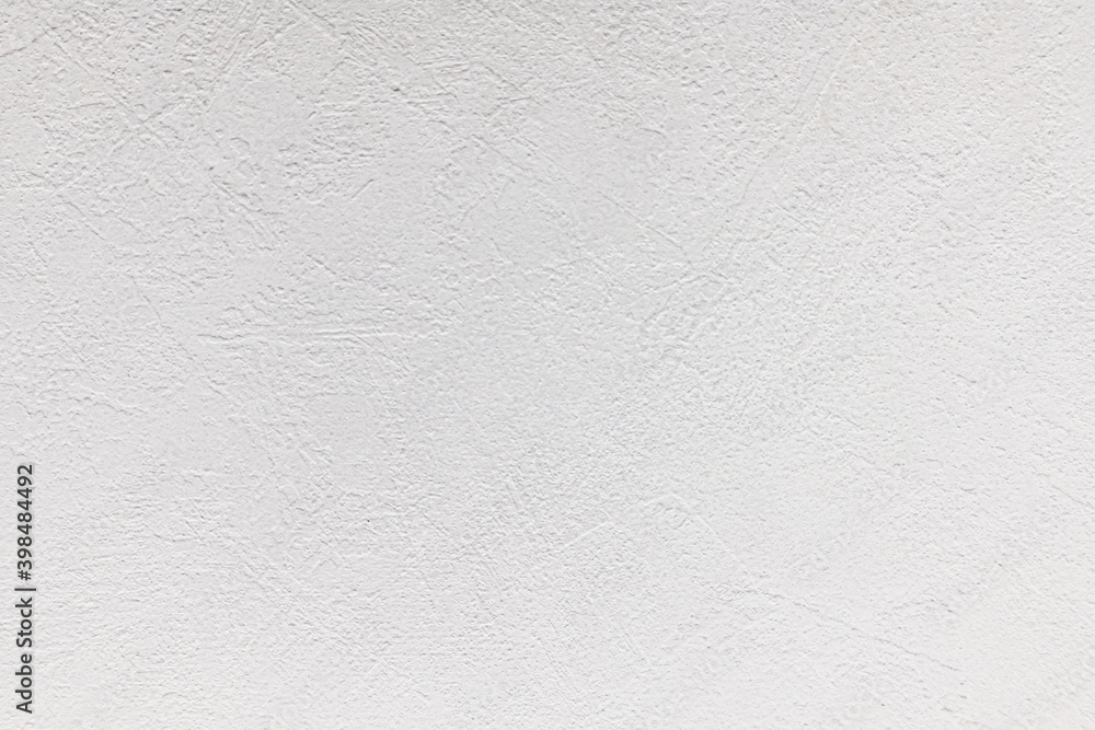 Obraz premium White concrete background with abstract textured pattern applied to the surface