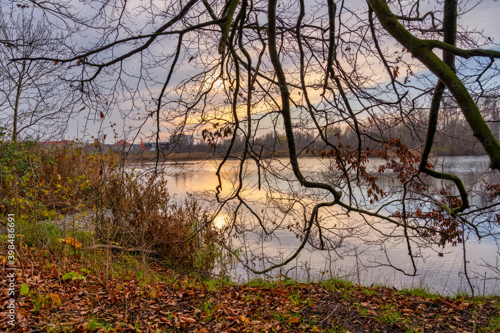 A beautiful sunset picture of a little lake. Photo from Lomma Beach, Scania county, Sweden A beautiful sunset picture of a little lake. Photo from Lomma Beach, Scania county, Sweden