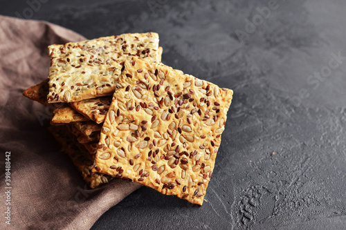 Papier peint Multigrain crunchy crispbread on a dark concrete background.