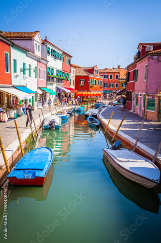 Boats in the channels of Burano, colourful island in the bay of Venice, Italy © hardyuno