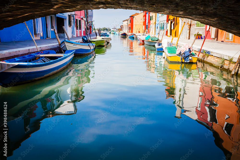 Reflecion in the channels of Burano, colourful island in the bay of Venice, Italy