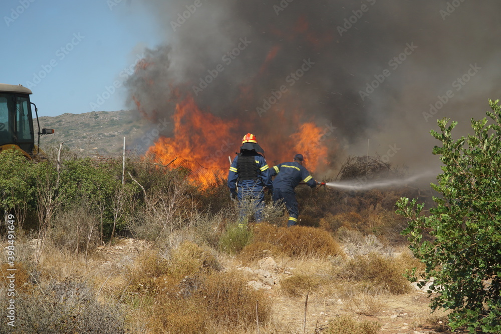 Fototapeta premium 2019 - ELAFONISOS ISLAND, GREECE. Wildfires in Elafonisos island during the tourist season and in a NATURA protected area.