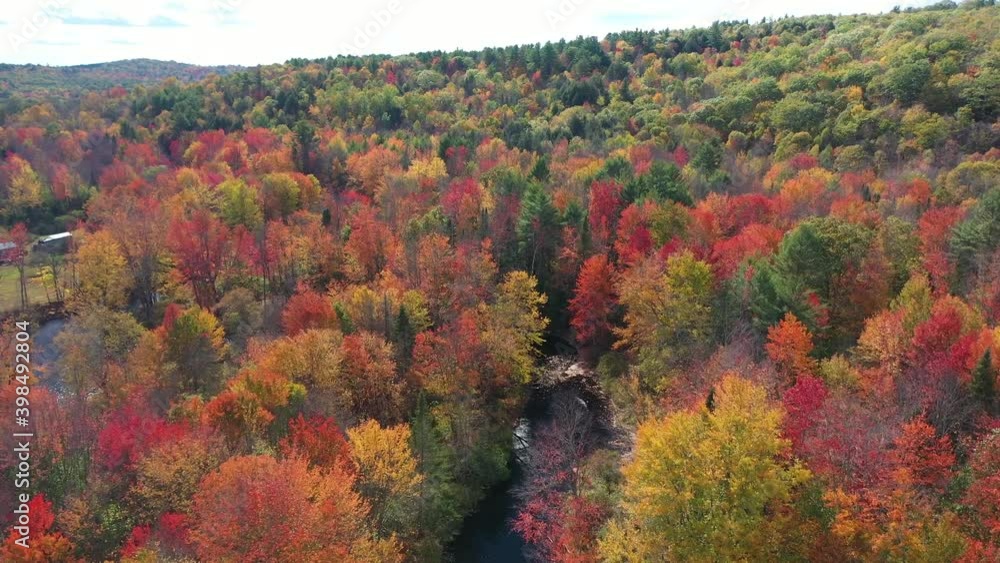 Magical Countryside Landscape on Sunny Autumn Day. Aerial View of Vivid Forest, River and Isolated Houses in New England, Maine USA Magical Countryside Landscape on Sunny Autumn Day. Aerial View of Vivid Forest, River and Isolated Houses in New England, Maine USA