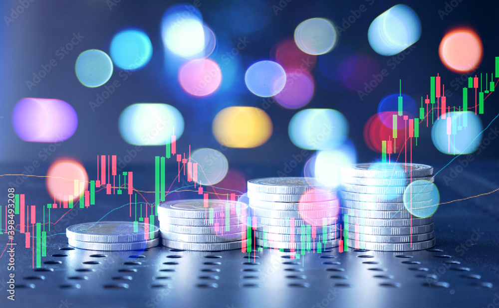 graph and rows of coins for finance business background
