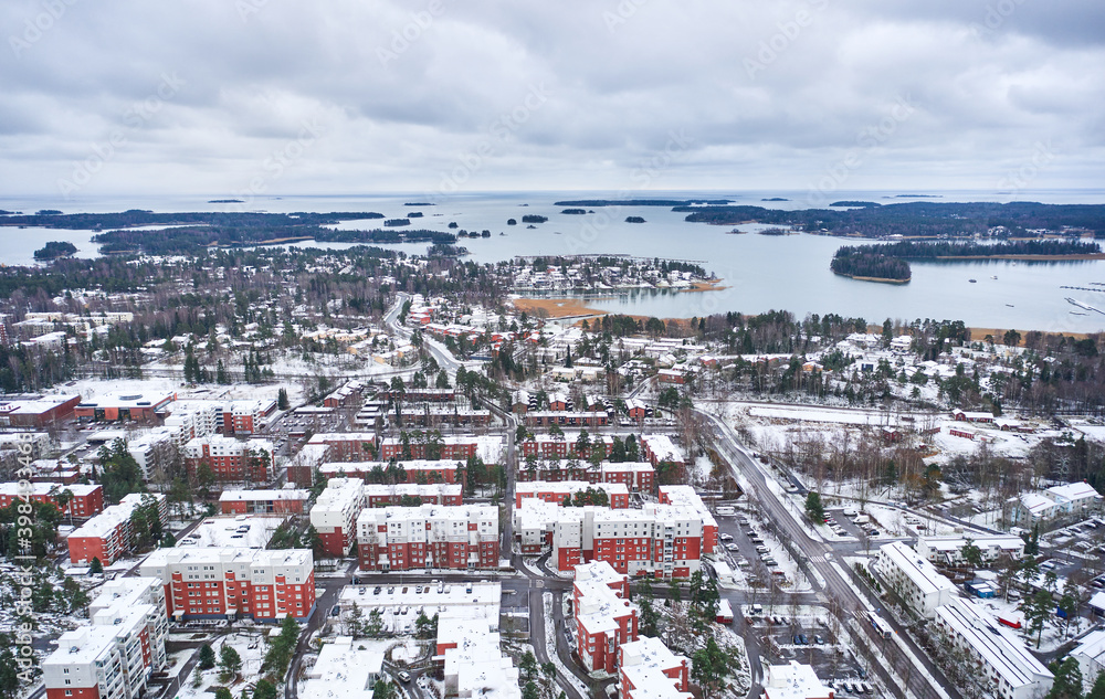 Aerial view of Matinkyla neighborhood of Espoo, Finland. First snow in the city. View of the Baltic Sea.
