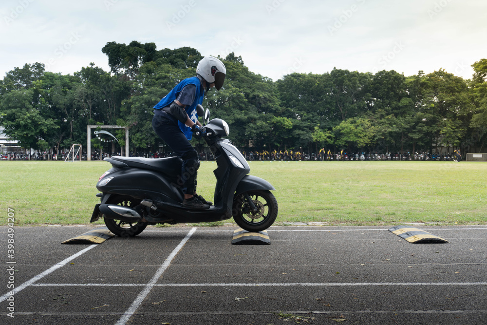 Man is learning to ride a bike . Biker beginner on a motorcycle.