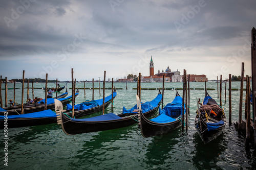 Traditional gondolas at the shore of Piazza San Marco in Venice, Venetian, Italy © hardyuno
