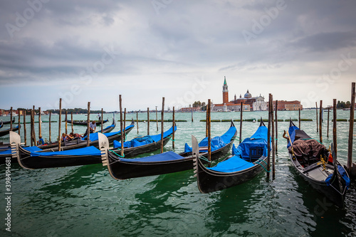 Traditional gondolas at the shore of Piazza San Marco in Venice, Venetian, Italy © hardyuno