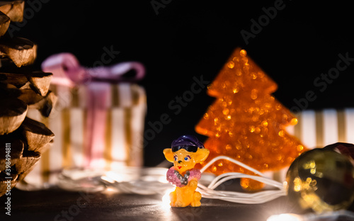 Christmas celebration, Christmas gifts and tree with toys and christmas balls isolated on black background. Christmas theme greetings concept.