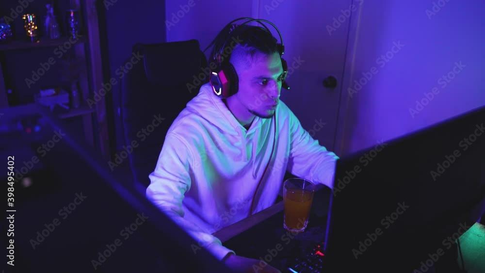 Professional video game player playing on personal computer Professional video game player playing on personal computer