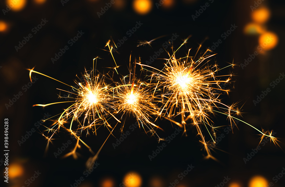 New year Sparklers and orange bokeh background