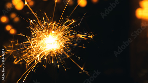 New year Sparklers and orange bokeh background