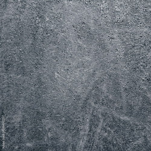 Textured surface with scratches, stripes, abrasions. Abstraction with light and dark paint. Square wallpaper.