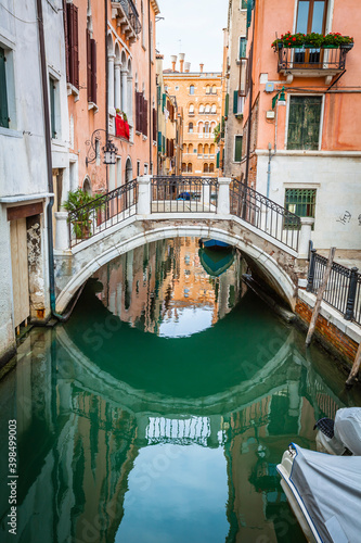 Boats and ancient houses in the channels of Venice, Venetian, Italy © hardyuno