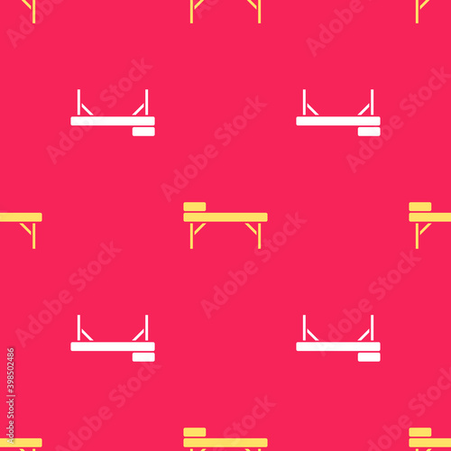 Yellow Massage table icon isolated seamless pattern on red background.  Vector.