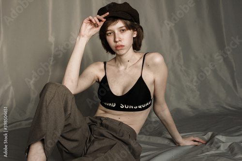 Obraz na plátně portrait of a young woman  in in trousers and a top