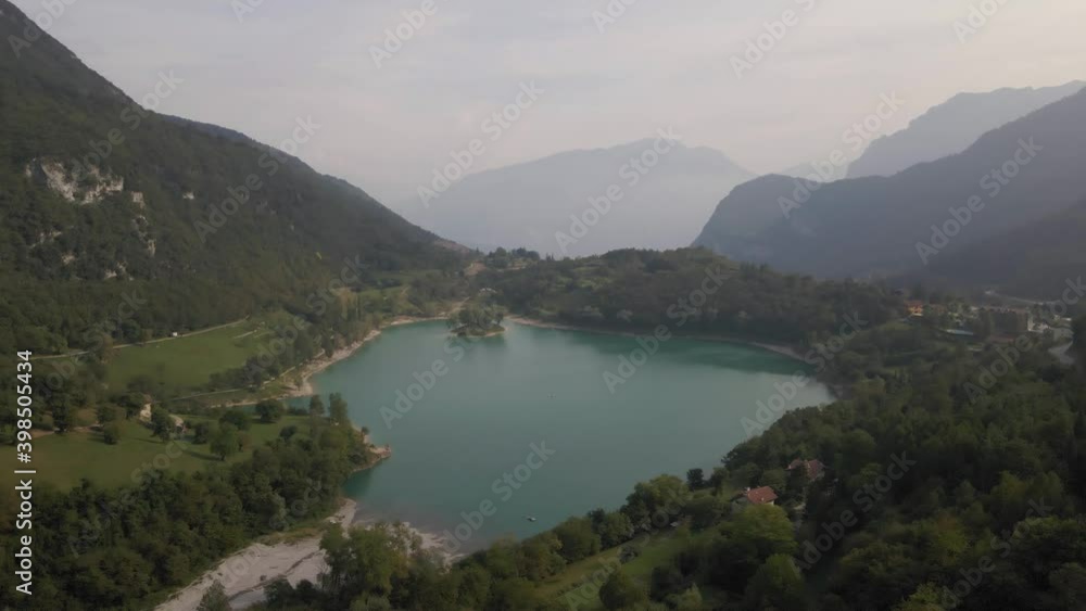 Aerial view of Tenno lake, Trentino, North Italy. Green landscape during a sunny day. Lake overview Aerial view of Tenno lake, Trentino, North Italy. Green landscape during a sunny day. Lake overview