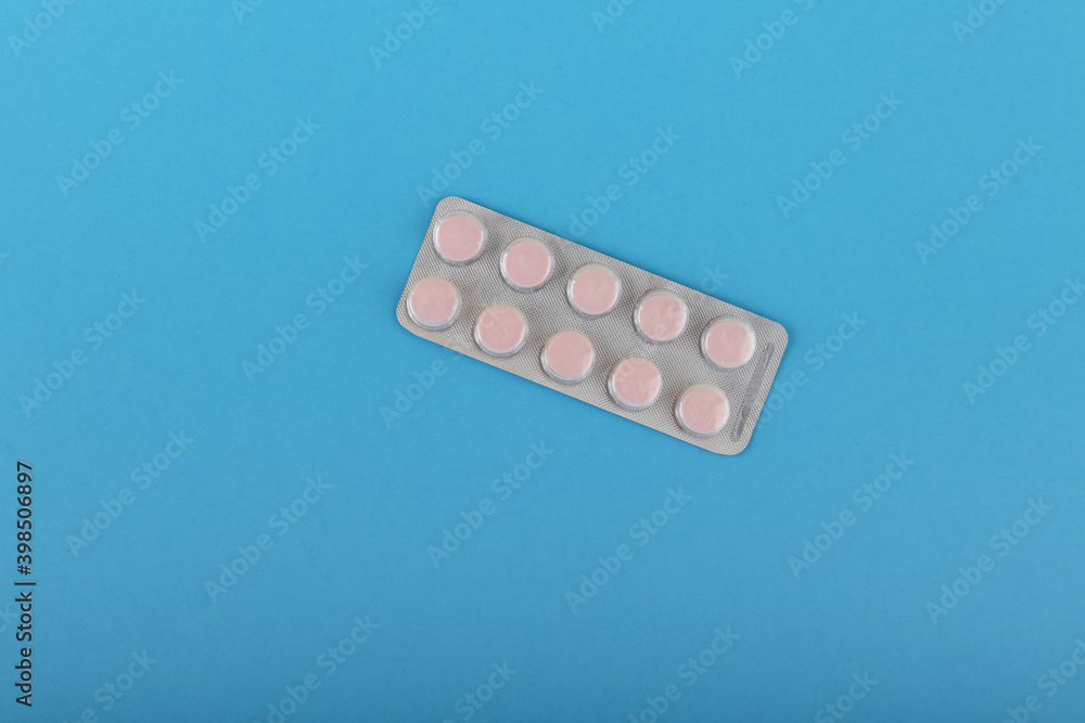 packaging of tablets on blue medical background top view with copy space packaging of tablets on blue medical background top view with copy space
