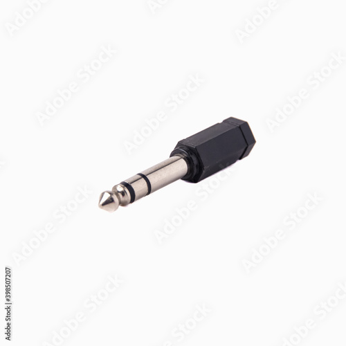 Plastic audio Jack adapter minijack to Jack, isolated on white background. Close up