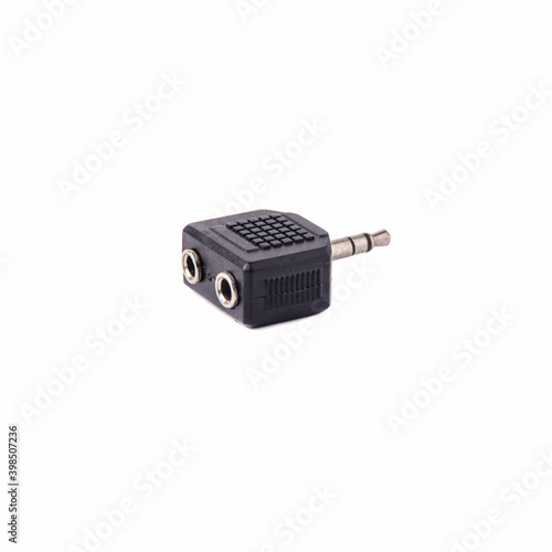 Mini Jack adapter with single to double output, isolated on white background. Close up