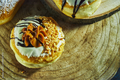 Happy Hanukkah and Hanukkah Sameach is a traditional Jewish donut with Dulce de Leche and chocolate. photo